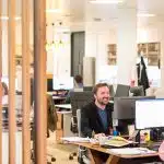 a man sitting at a desk in an office
